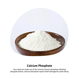 Calcium phosphate powder in wooden bowl for dental health.