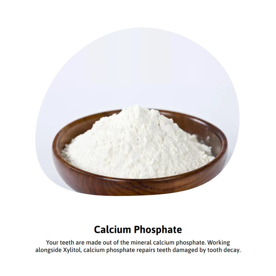 Calcium phosphate powder in wooden bowl for dental health.